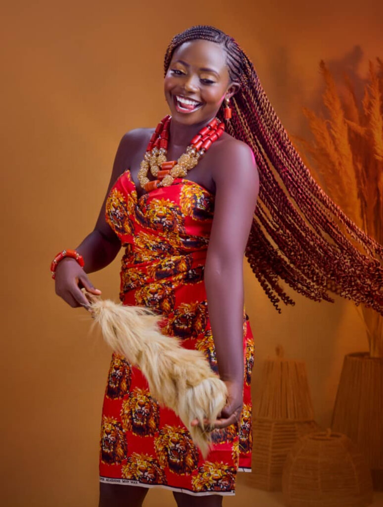 Elegant birthday flyer of Jennifer Ginika featuring a smiling young girl with a warm golden background and celebration message